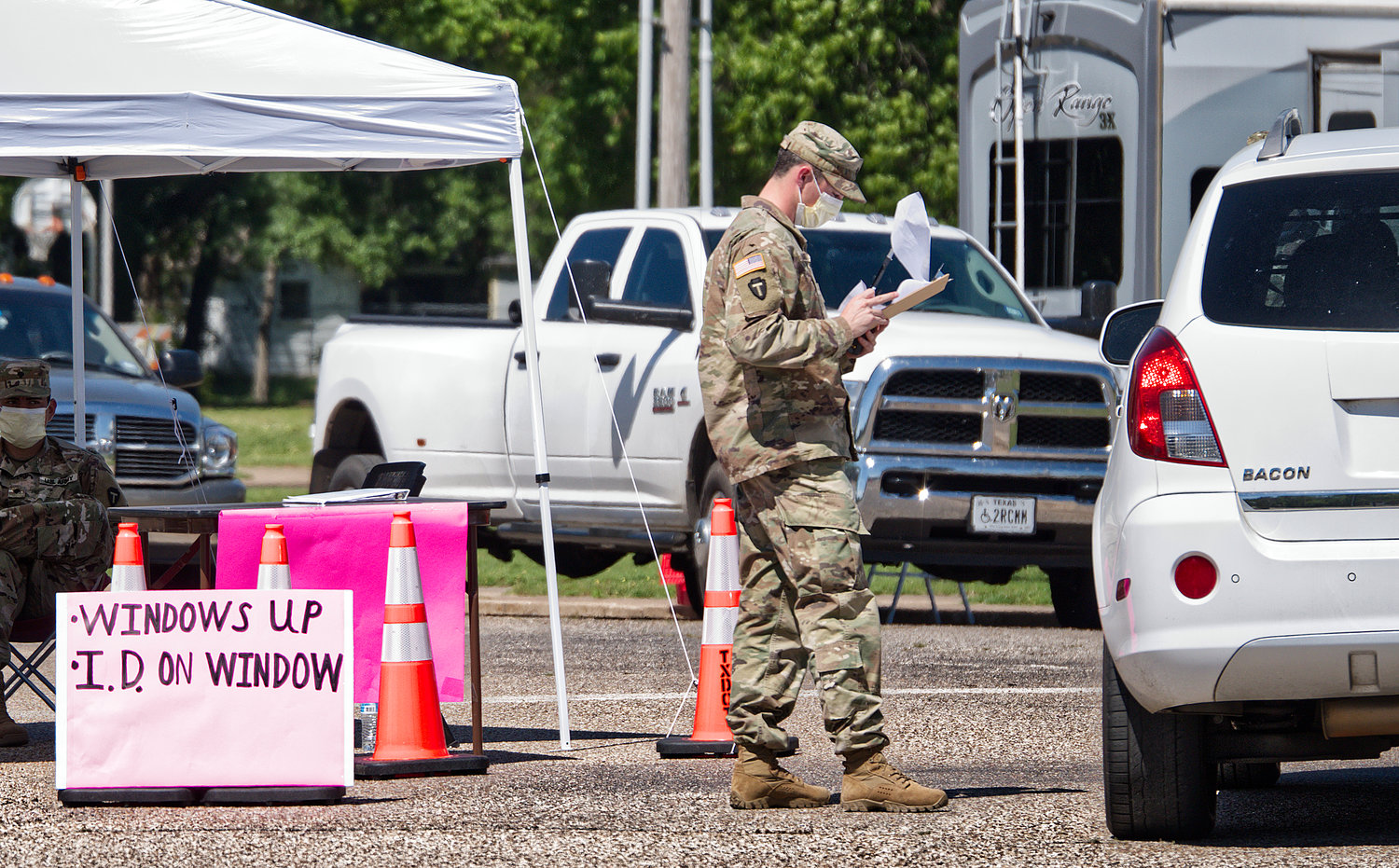 National Guard troops check in citizens for COVID-19 testing Friday at the Mineola Civic Center, where a mobile testing site was established by the Texas Dept. of State Health Services.